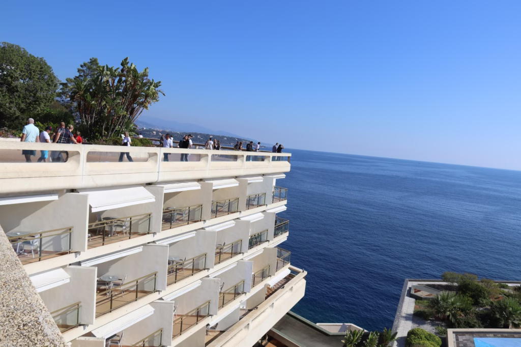 White residence balconies stepping down to deep blue sea