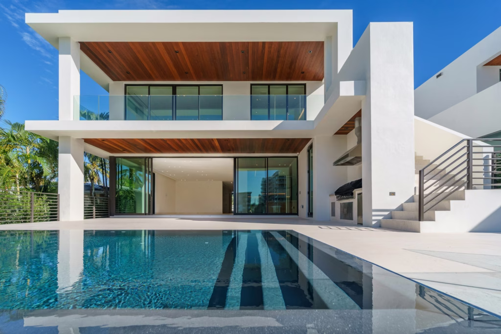 Villa 01 at NOVA COAST: white two-storey villa with a timber soffit and private lap pool